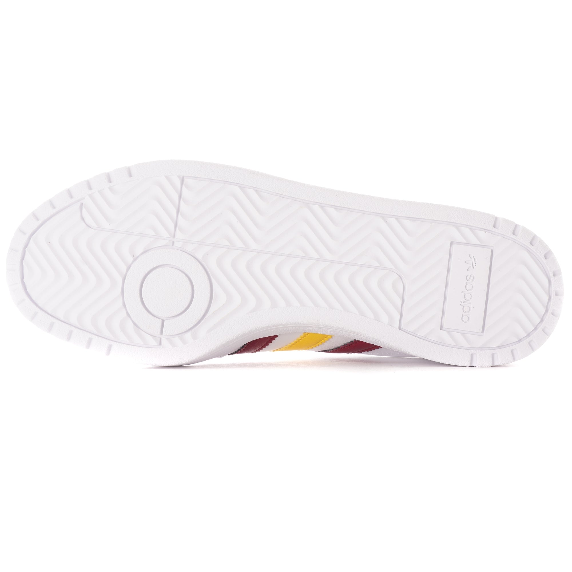 The white sole of an Adidas trainer, showing textured grip patterns.