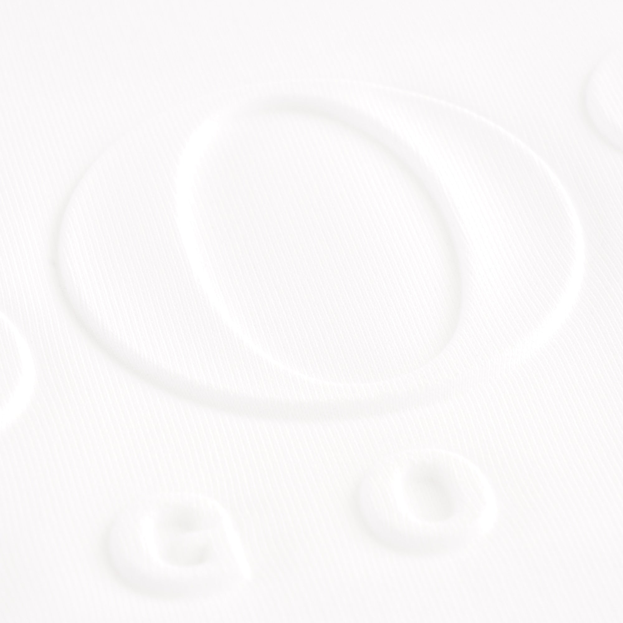 Close-up of the embossed BOSS branding on the white short-sleeved hoodie.