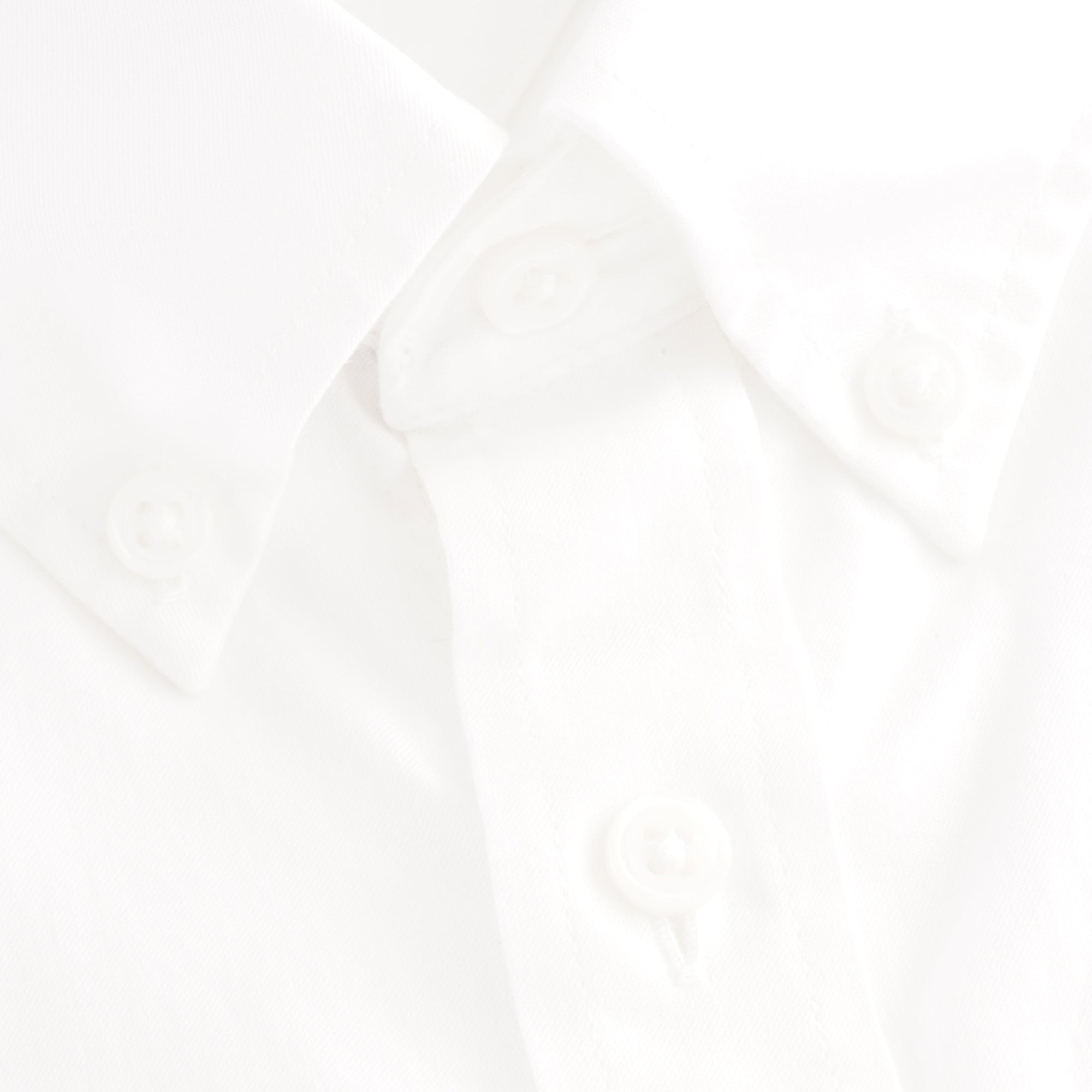 A close up of the white Tommy Hilfiger shirt buttons.