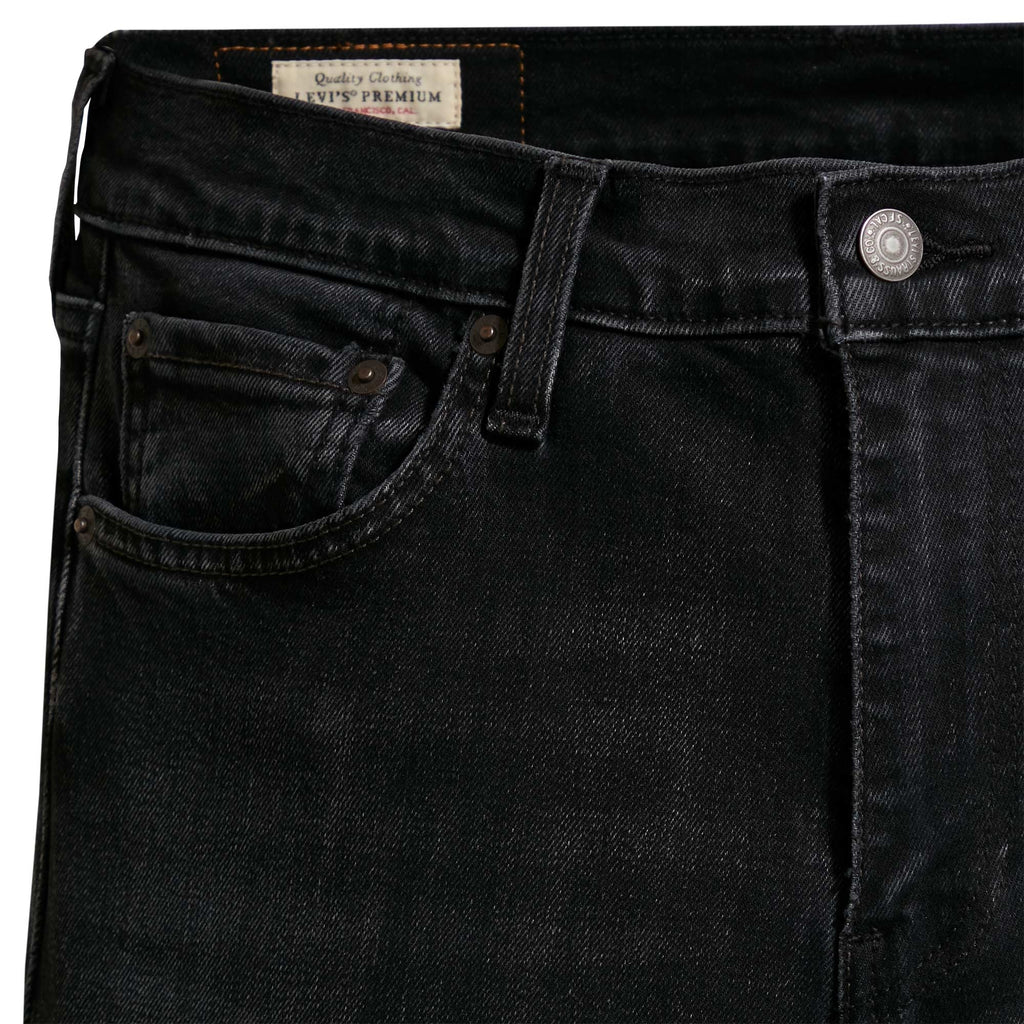 Detailed view of the front pocket area on Levi's 519 men's black jeans.
