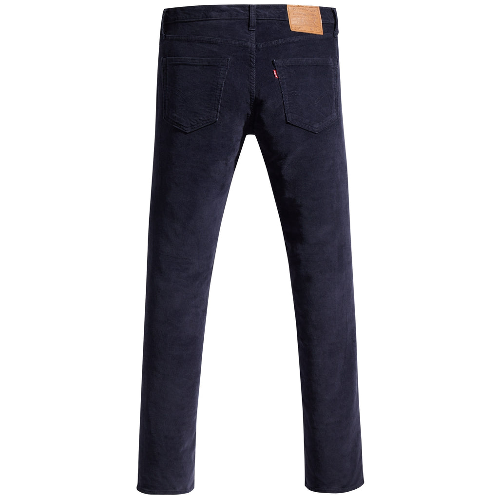 A full-length rear view of navy corduroy trousers on a white background.