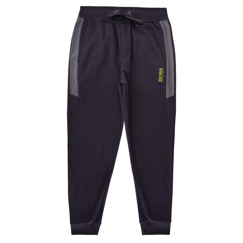 A full-length view of the front of the BOSS tracksuit bottoms.