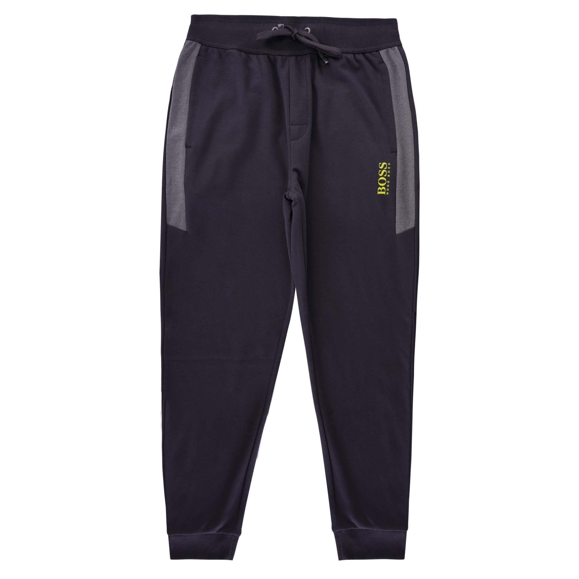 A full-length view of the front of the BOSS tracksuit bottoms.