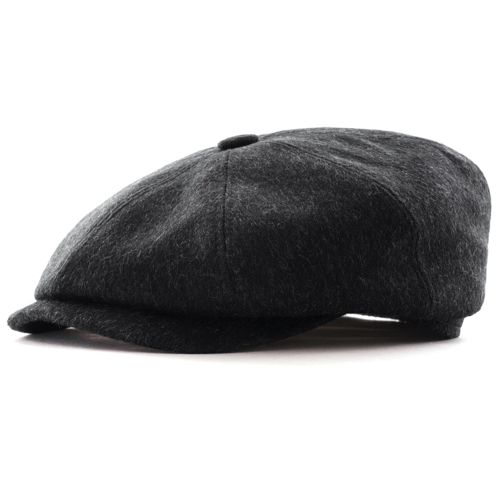 A smart charcoal grey flat cap made from wool blend fabric, side view.