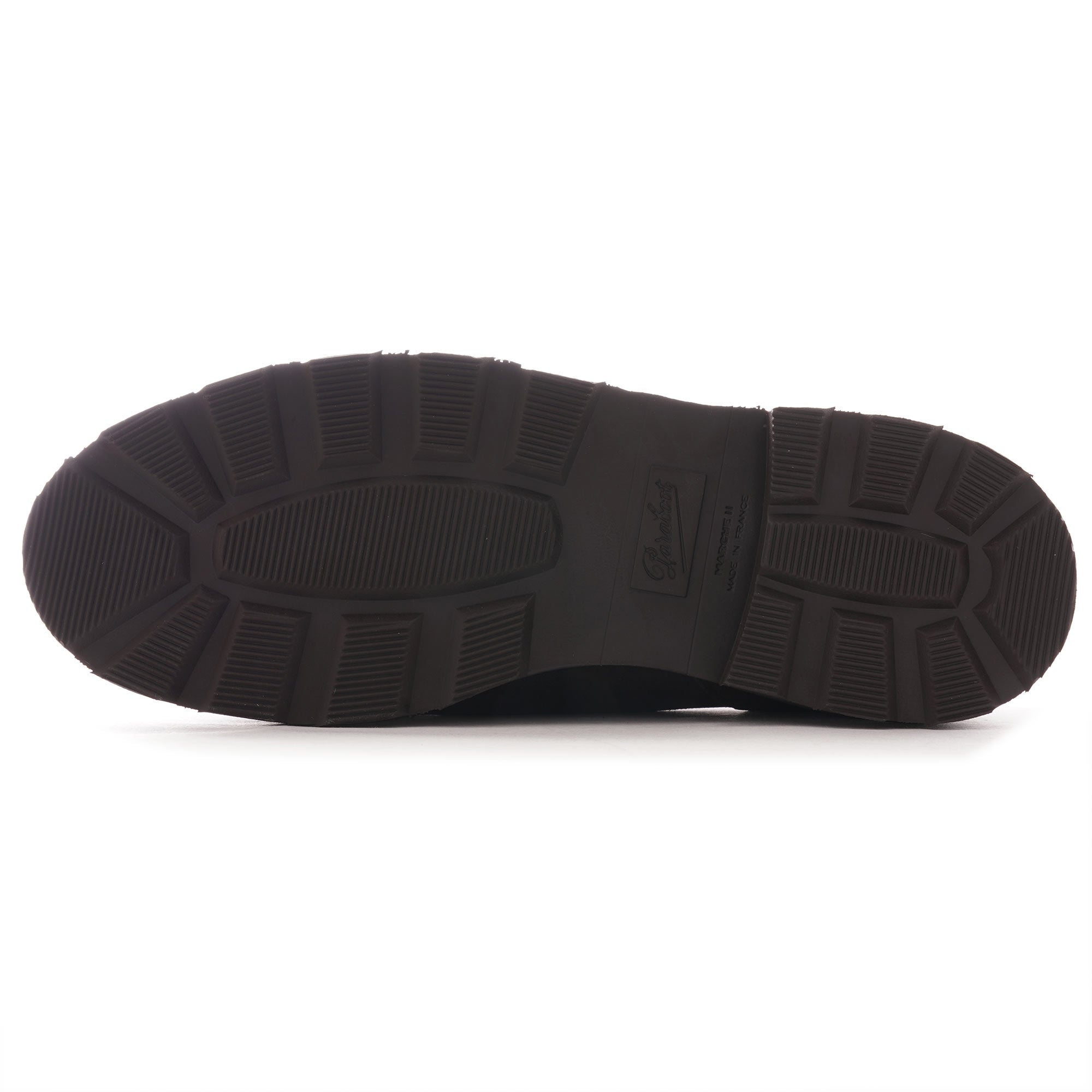 Underside of a brown shoe showing the tread and sole pattern.