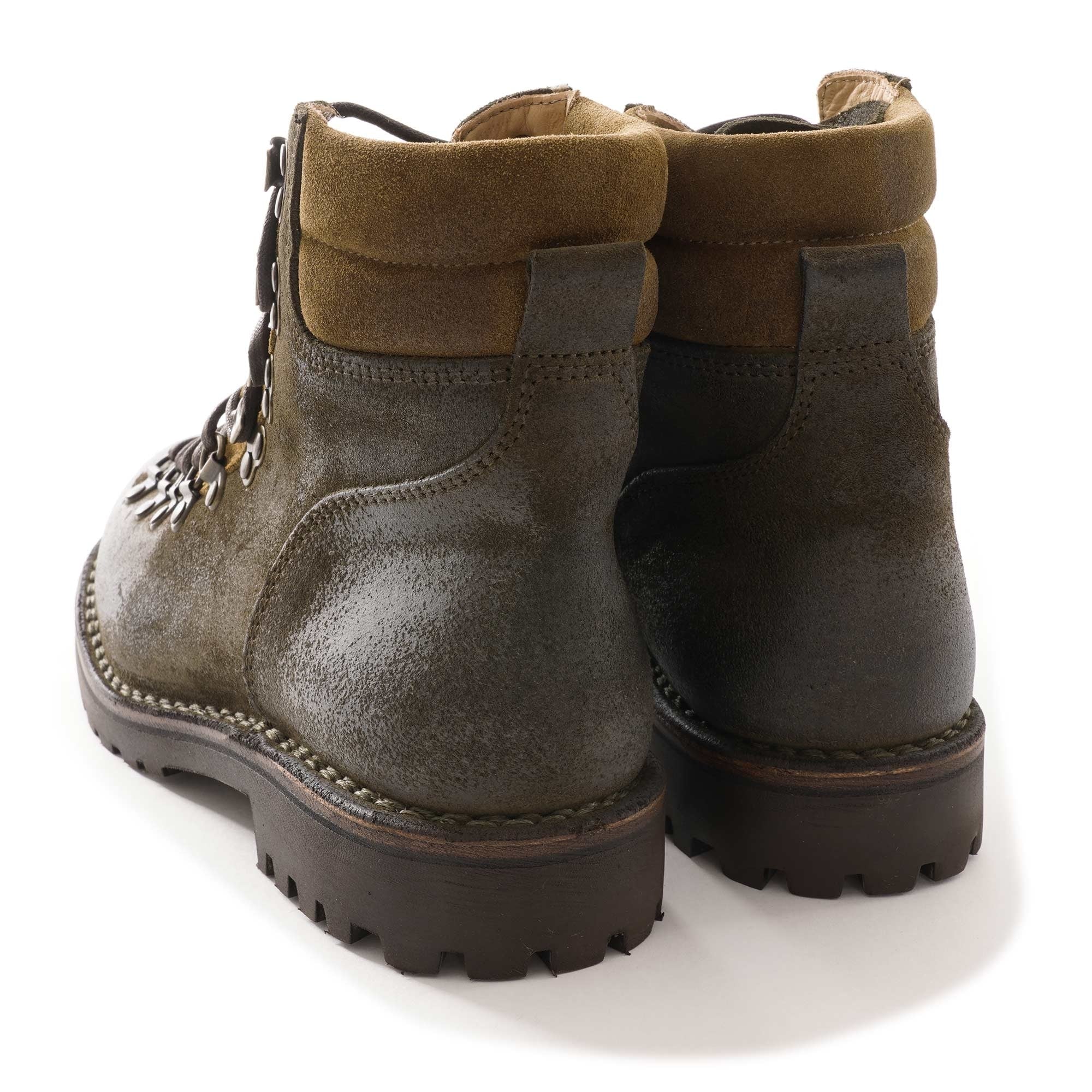 A pair of dark olive-green suede hiking boots with brown padded cuffs, rear view.