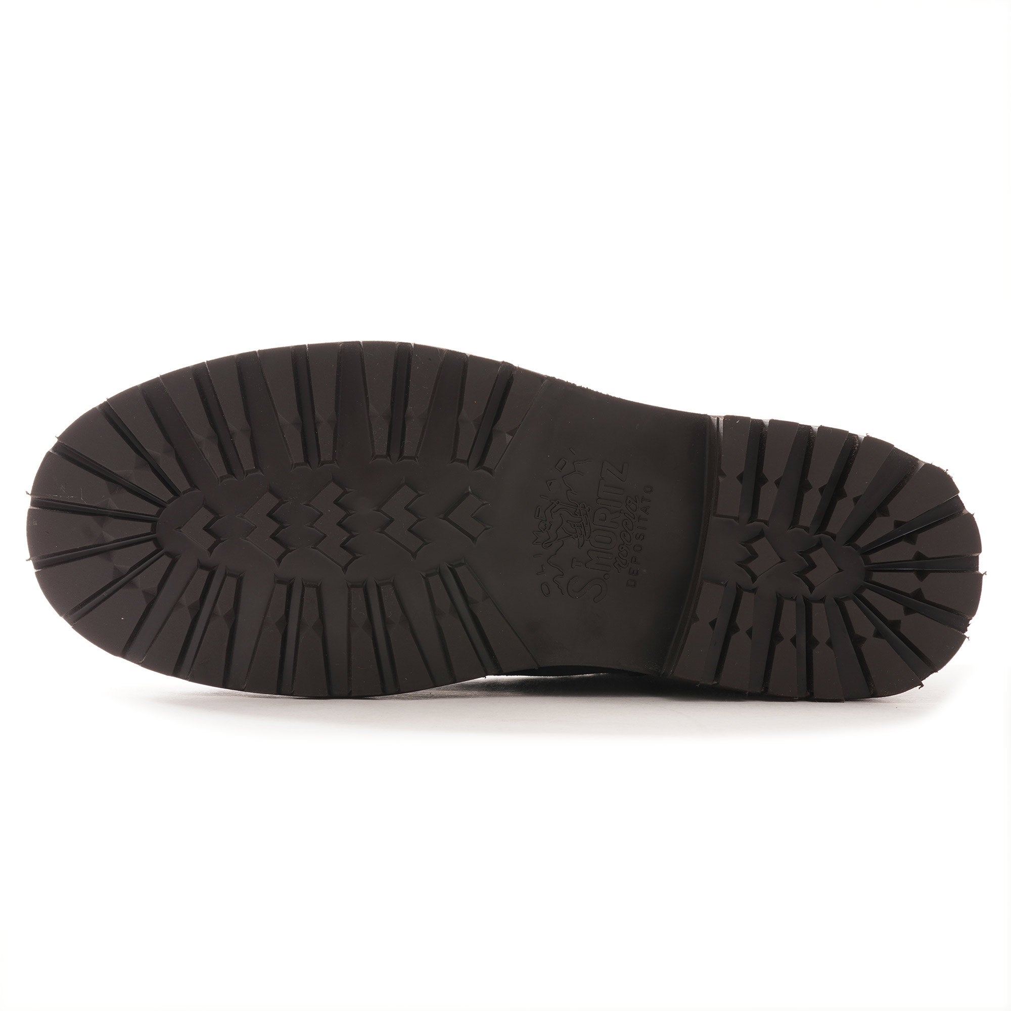 The textured, dark brown rubber sole of a hiking boot, viewed from below.