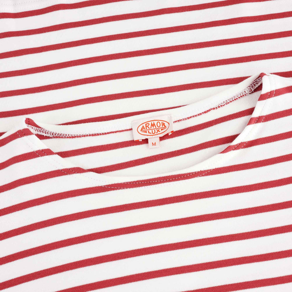 A close-up of the shirt's neckline with the brand label visible. 