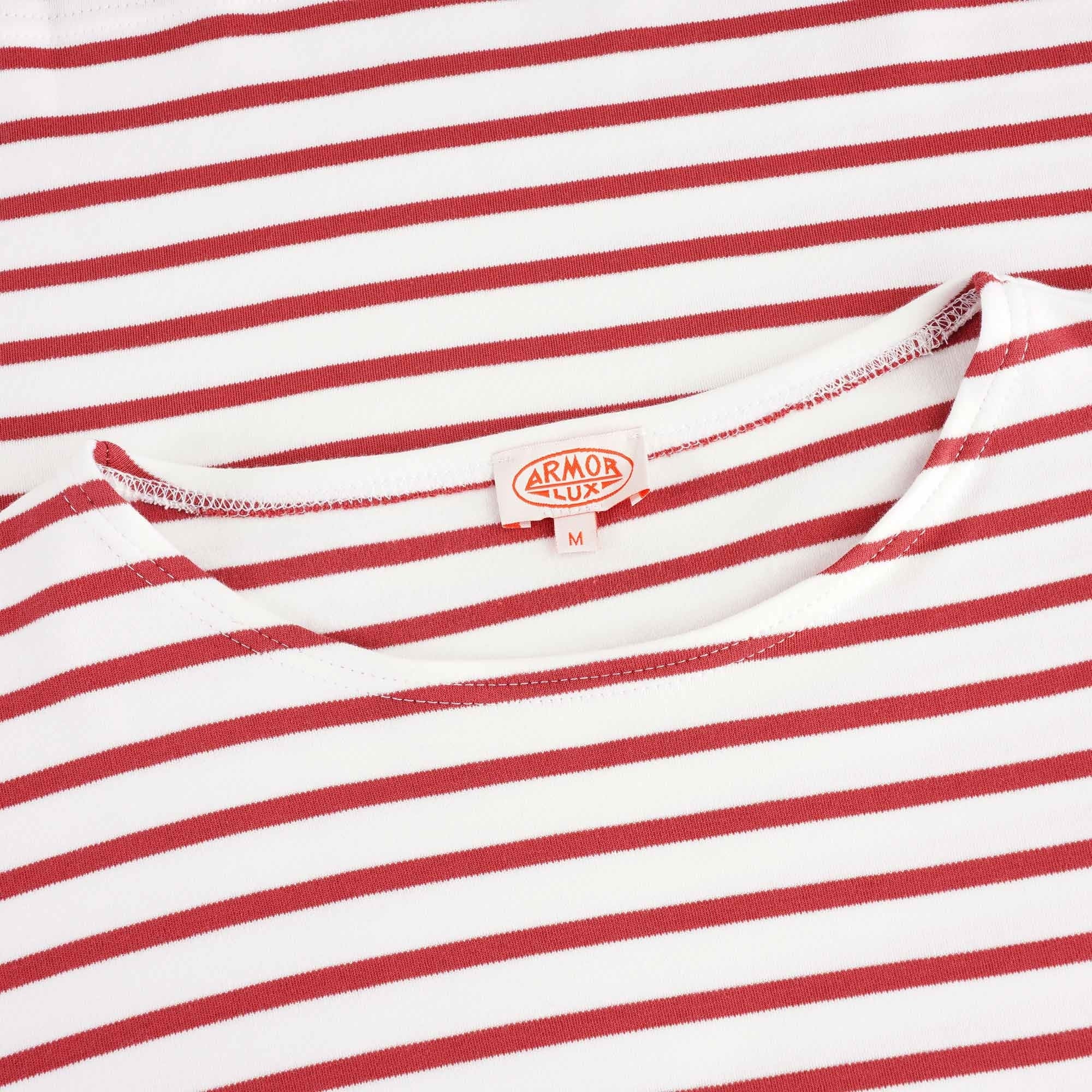 A close-up of the shirt's neckline with the brand label visible. 