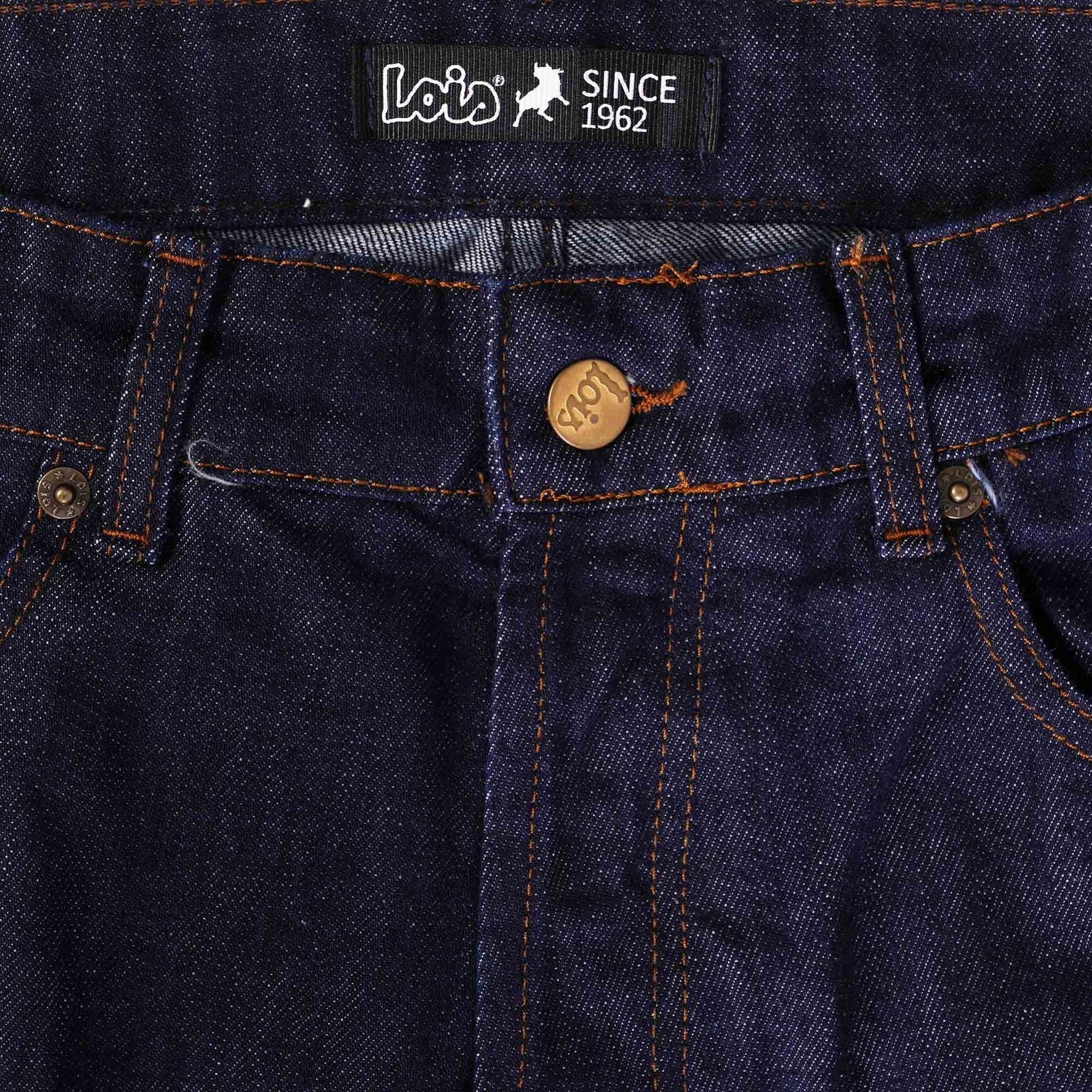 Close-up of the waistband of men's dark blue jeans showing the gold button fly and brand.