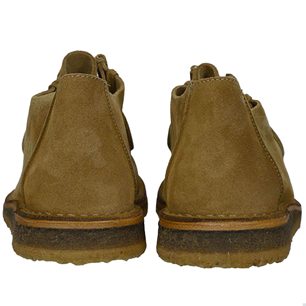 Rear view of a pair of tan suede shoes highlighting the heel and crepe sole.