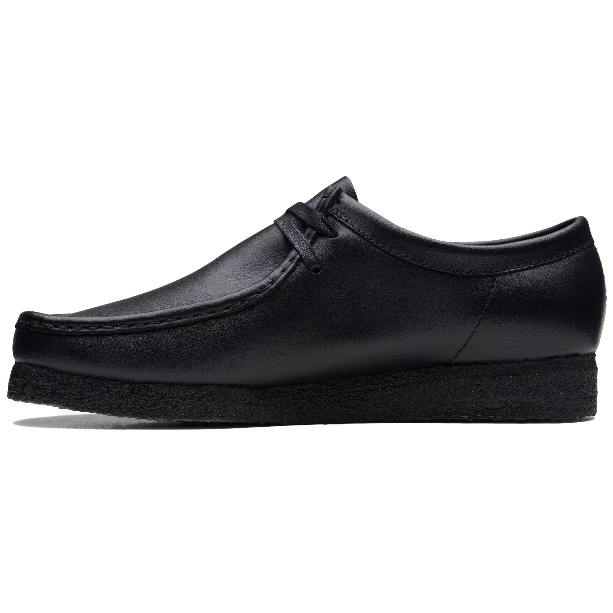 Side profile of a black leather Clarks Originals Wallabee shoe on a white background.