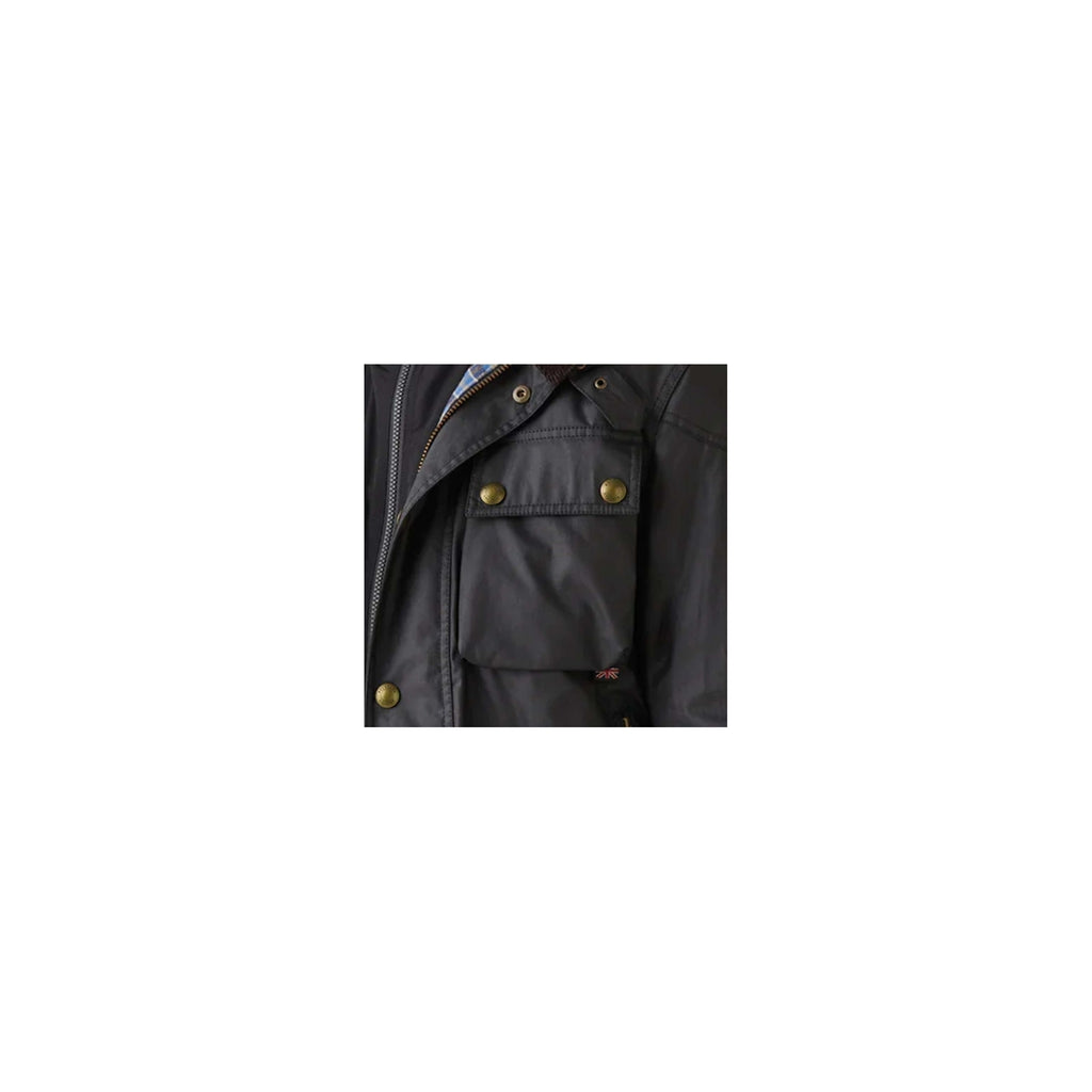 The upper right pocket of a black jacket with brass fastenings.