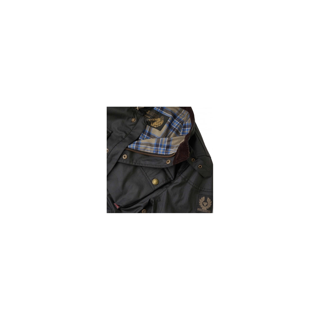 The black jacket, partially open to reveal a blue and brown tartan lining.
